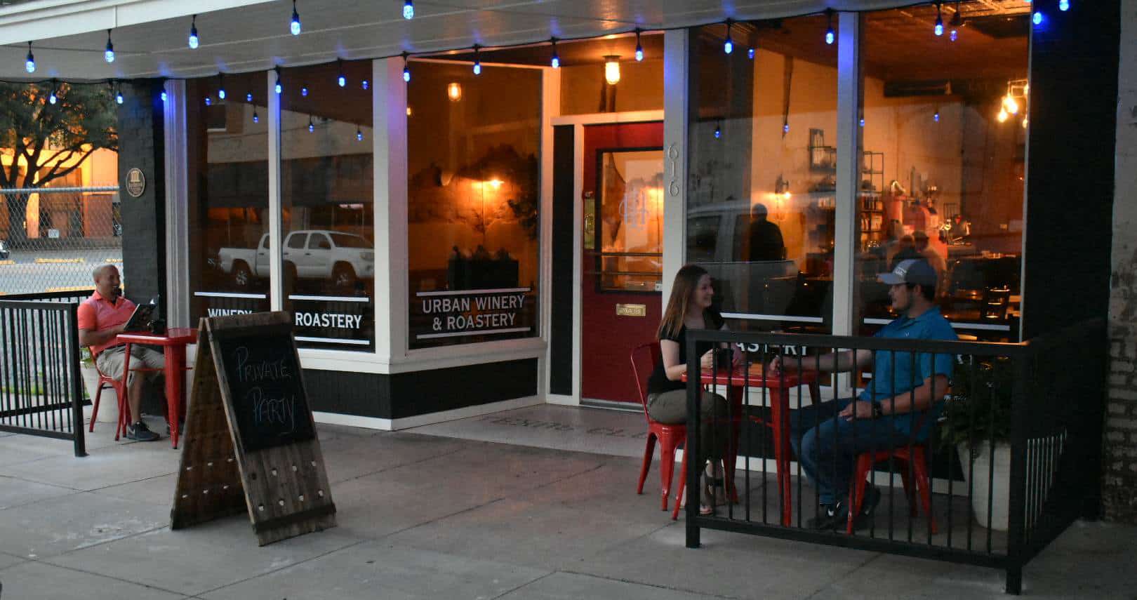 The Hook & Ladder storefront on 7th Street at dusk, string lights overhead